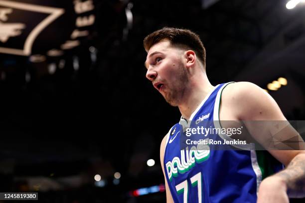 Luka Doncic of the Dallas Mavericks reacts toward the team bench after a basket against the Los Angeles Lakers in the second half at American...