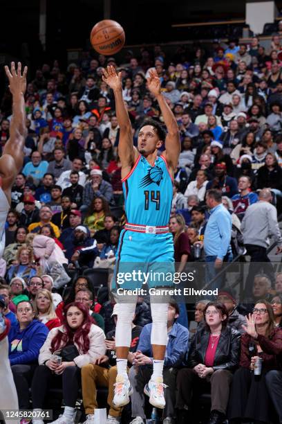 Landry Shamet of the Phoenix Suns shoots a three point basket during the game against the Denver Nuggets on December 25, 2022 at the Ball Arena in...