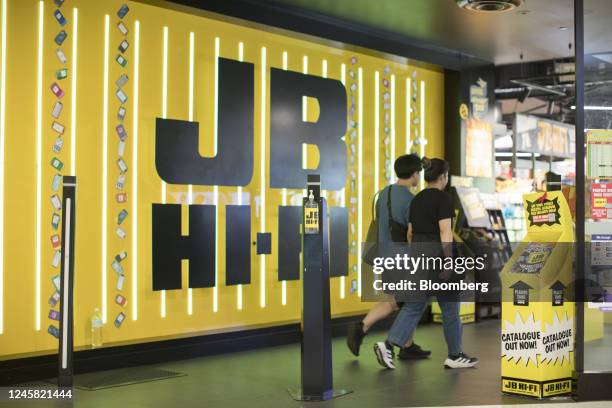 People enter a JB Hi-Fi Ltd. Store in Sydney, Australia, on Monday, Dec. 26, 2022. Australias consumer sentiment remained deeply pessimistic and...