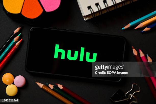 In this photo illustration a Hulu logo seen displayed on a smartphone.