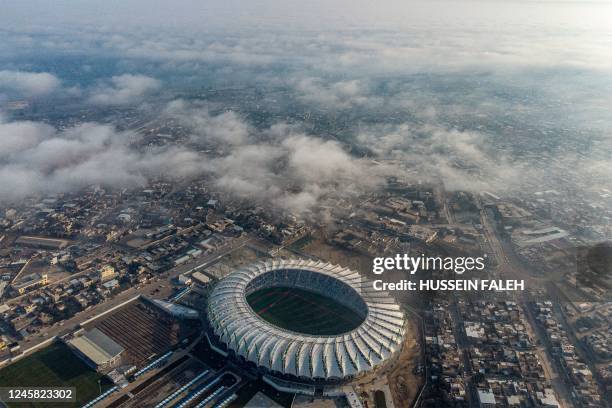 This picture taken on December 26, 2022 shows an aerial view of the New Minaa Olympic Stadium, built to accomodate 30,000 spectators, in Iraq's...