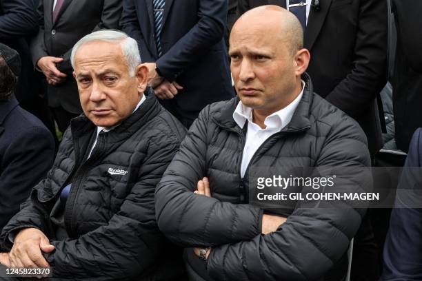 Israel's prime minister-designate Benjamin Netanyahu and former prime minister Naftali Bennett attend the funeral of Israeli Orthodox Jewish rabbi...
