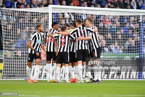 Players of Newcastle celebrate after Chris Wood of Newcastle Uniteds penalty put Newcastle United 1-0 up during the Premier League match between...