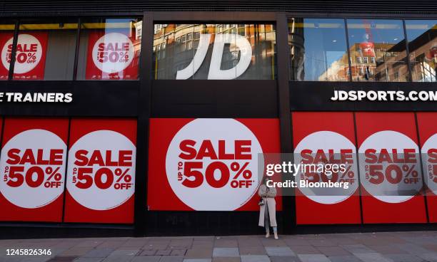 Sale offers advertised in the windows of a JD Sports Fashion Plc store during traditional Boxing Day holiday sales, in London, UK, on Monday, Dec....