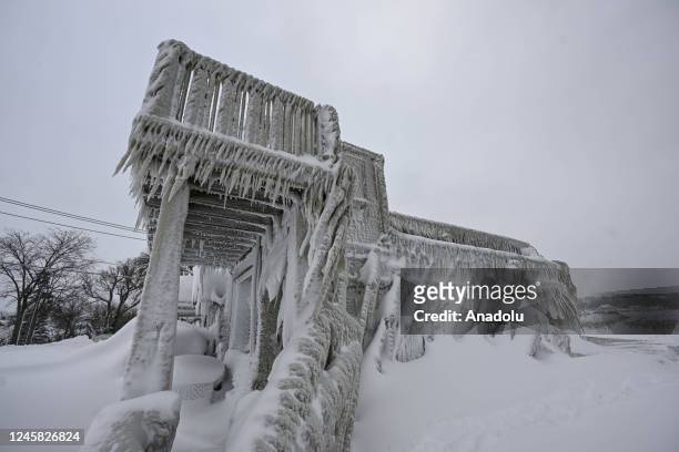 House completely covered in ice is seen after snowfall as death toll in the snowstorm, which was effective, reached 26 in Buffalo, New York, United...
