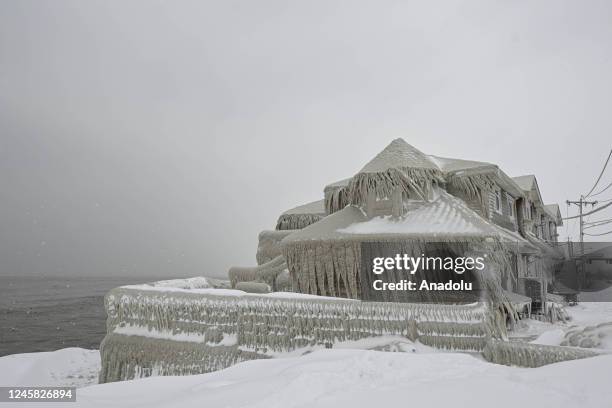 House completely covered in ice is seen after snowfall as death toll in the snowstorm, which was effective, reached 26 in Buffalo, New York, United...