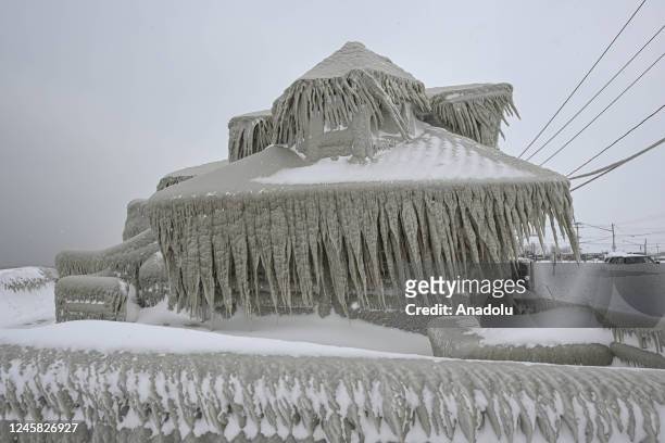 House completely covered in ice is seen after snowfall as death toll in the snowstorm, which was effective, reached 26 in Buffalo, New York, United...