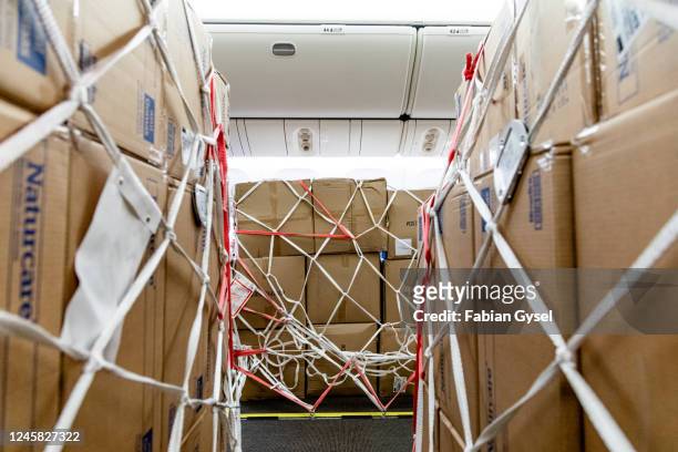 cargo in the cabin of a passenger aircraft in the coronavirus crisis - vehicle interior stock pictures, royalty-free photos & images