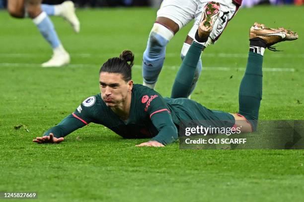 Liverpool's Uruguayan striker Darwin Nunez reacts after missing to score during the English Premier League football match between Aston Villa and...