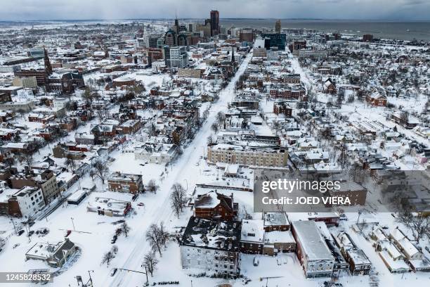 Snow blankets the city in this aerial drone photograph in Buffalo, New York, on December 25, 2022. - US emergency crews counted the grim costs of a...