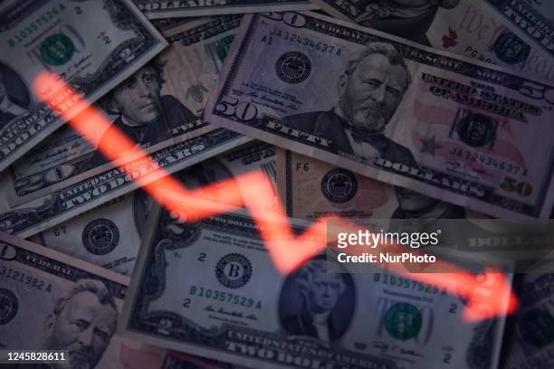 United States dollar banknotes and an illustrative stock graph displayed on a screen are seen in this multiple exposure illustration photo taken in...