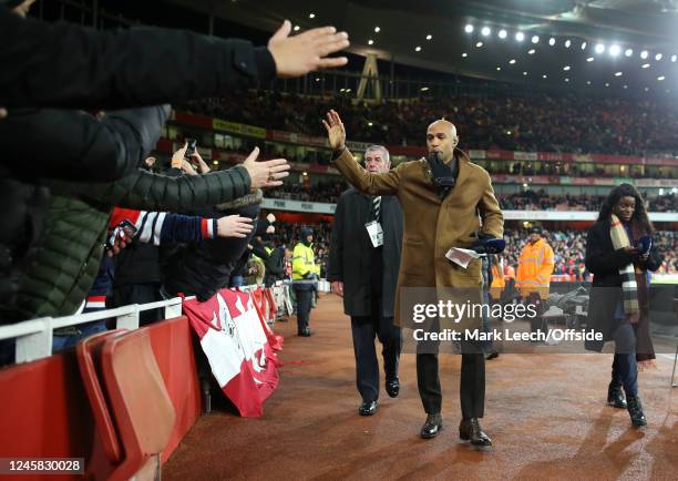 Ex Arsenal player Thierry Henry hi-fives fans at the Emirates ahead of the Premier League match between Arsenal FC and West Ham United at Emirates...