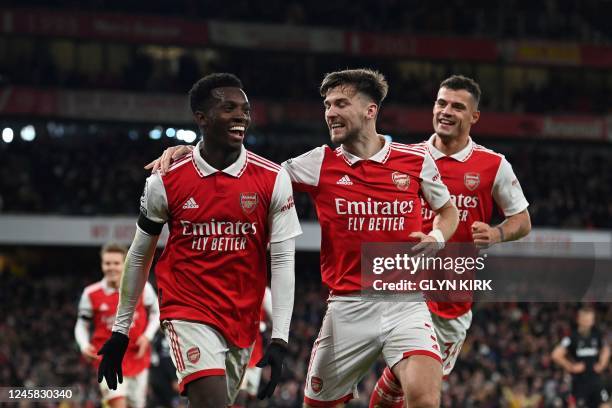 Arsenal's English striker Eddie Nketiah celebrates after scoring his team third goal during the English Premier League football match between Arsenal...