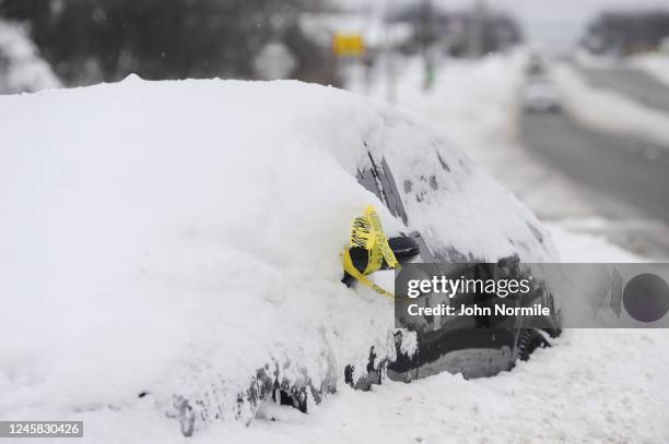 An abandoned vehicle sits along Southwestern Boulevard on December 26, 2022 in West Seneca, outside Buffalo, New York. The historic winter storm...