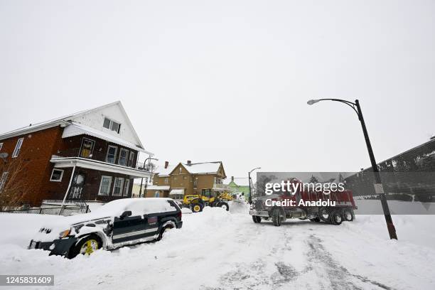 Loader clears a street covered with snow after snowfall in Buffalo, New York, United States on December 26, 2022.