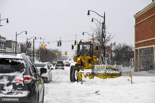 Loader clears a street covered with snow after snowfall in Buffalo, New York, United States on December 26, 2022.