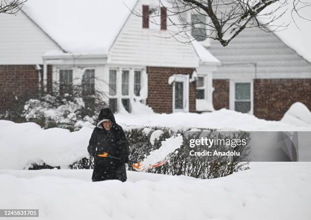 Man shovels snow after snowfall in Buffalo, New York, United States on December 26, 2022.