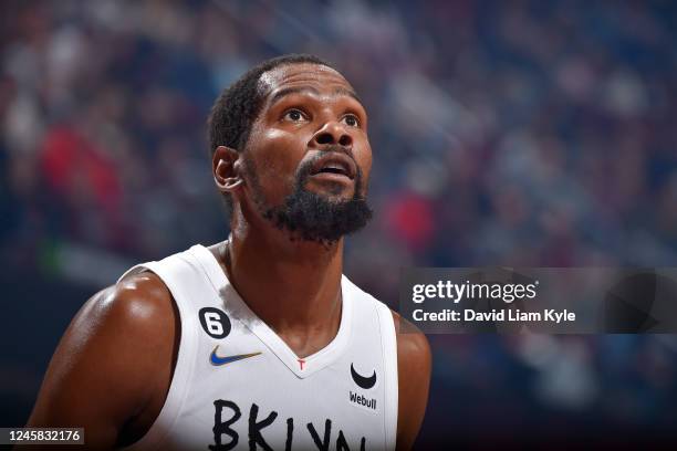 Kevin Durant of the Brooklyn Nets looks on during the game against the Cleveland Cavaliers on December 26, 2022 at Rocket Mortgage FieldHouse in...