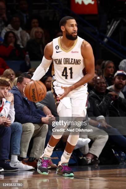 Garrett Temple of the New Orleans Pelicans dribbles the ball during the game against the Indiana Pacers on December 26, 2022 at the Smoothie King...