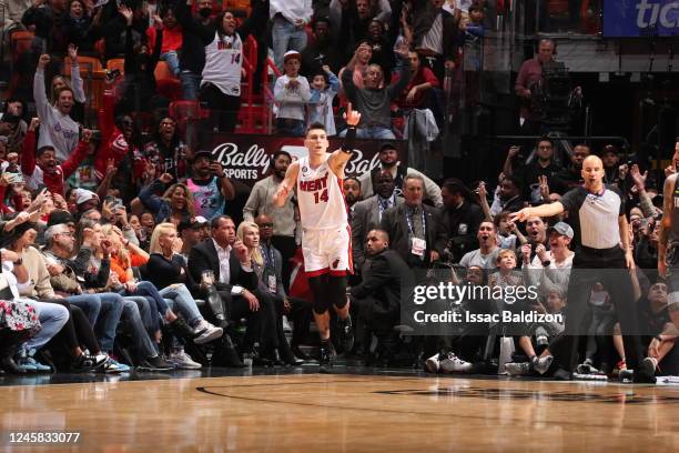 Fans celebrate a play by Tyler Herro of the Miami Heat on December 26, 2022 at FTX Arena in Miami, Florida. NOTE TO USER: User expressly acknowledges...