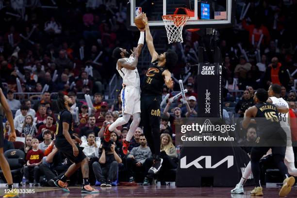 Jarrett Allen of the Cleveland Cavaliers blocks a shot by Kyrie Irving of the Brooklyn Nets during the third quarter of the game at Rocket Mortgage...