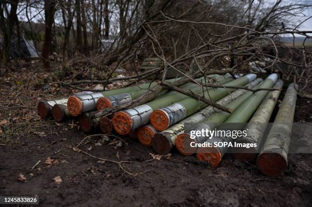 Rockets from a multiple rocket launcher system are covered with excess tree limbs as the fighting in the Donbas region continues.