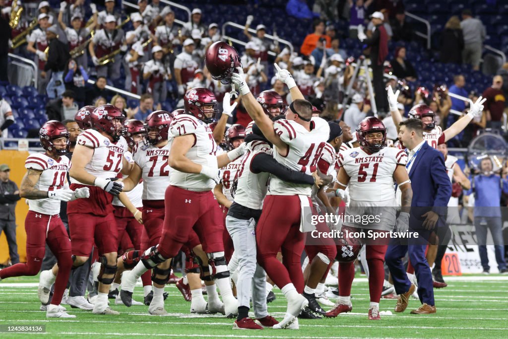 New Mexico State players celebrate winning the Quick Lane Bowl... News