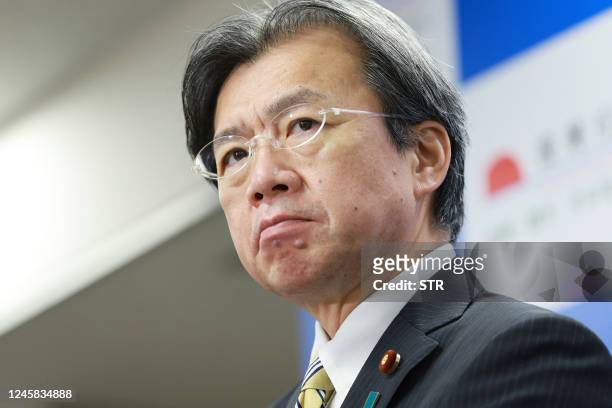 Japan's Reconstruction Minister Kenya Akiba holds a press conference in Tokyo on December 27, 2022. - Japan's reconstruction minister Akiba resigned...