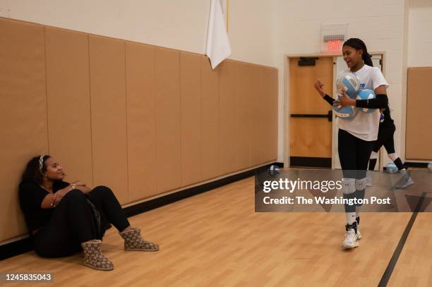 Alexis Ewing talks to her mom Cheryl Weaver during practice at King Abdullah Academy in Herndon, VA on December 14, 2022.
