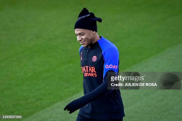 Paris Saint-Germain's French forward Kylian Mbappe takes part in a training session at the club's "Camp des Loges" training ground in...
