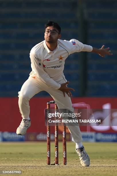 Pakistan's Abrar Ahmed delivers a ball during the second day of the first cricket Test match between Pakistan and New Zealand at the National Stadium...