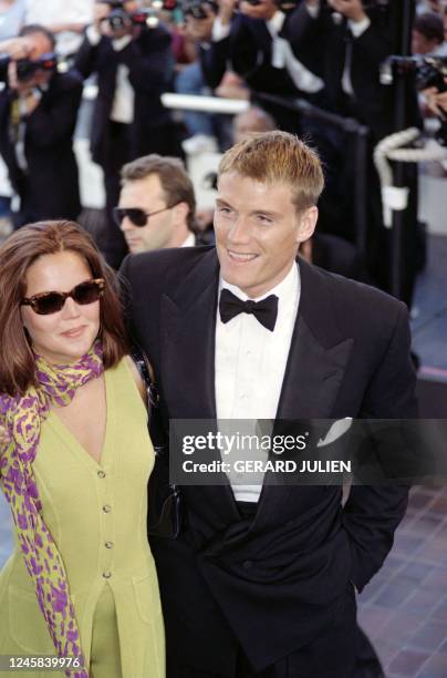 Swedish actor and producer Dolph Lundgren poses for the photographers with his companion Anette Qviberg during The Montee des Marches at the 45th...