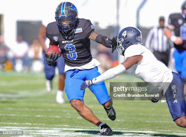 Quian Williams of the Buffalo Bulls gives Tyler Bride of the Georgia Southern Eagles a stiff arm during the first half of the TaxAct Camellia Bowl at...