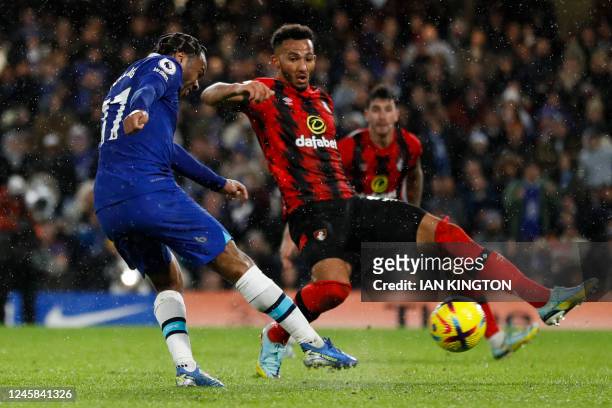 Chelsea's English midfielder Raheem Sterling fights for the ball with Bournemouth's English striker Dominic Solanke during the English Premier League...
