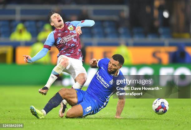 Burnley's Connor Roberts is tackled by Birmingham City's Troy Deeney during the Sky Bet Championship between Burnley and Birmingham City at Turf Moor...