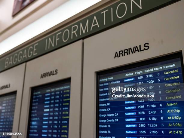 The arrivals board shows cancelled flights at the Southwest Airlines Baggage Claim at Midway Airport on December 27, 2022 in Chicago, Illinois. A...