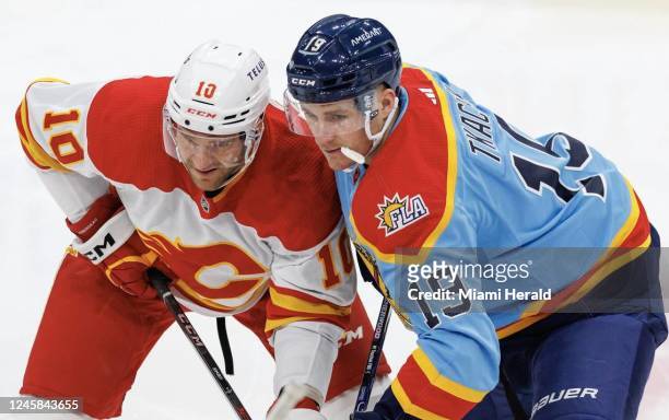 Calgary Flames center Jonathan Huberdeau and Florida Panthers left wing Matthew Tkachuk fighting for position during a face off during the first...