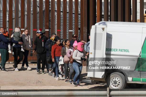 Venezuelan and Nicaraguan migrants are transferred by agents of the Border Patrol after crossing the Rio Grande river from Ciudad Juarez, Chihuahua...