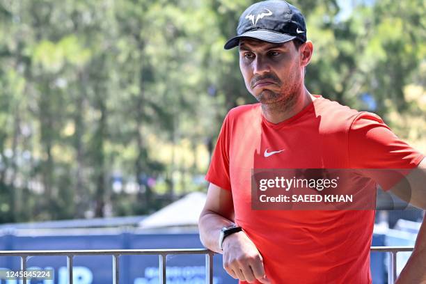 Rafael Nadal of Spain poses for pictures after a press conference with team members at the Tennis Centre in Sydney on December 28 ahead of the United...