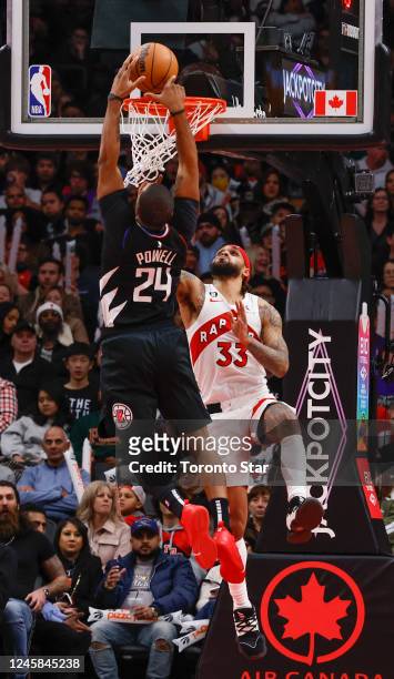 Clippers forward Norman Powell with a slam over Toronto Raptors guard Gary Trent Jr. . Toronto Raptors vs Los Angeles Clippers in 2nd half action of...