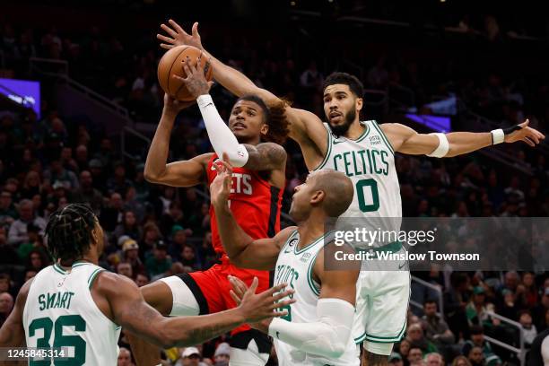 Jayson Tatum of the Boston Celtics comes from behind to try to block a shot by Jalen Green of the Houston Rockets during the second half at TD Garden...