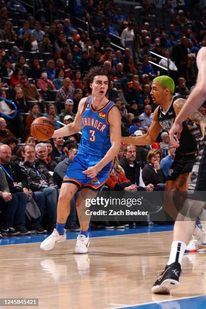 Josh Giddey of the Oklahoma City Thunder drives to the basket against the San Antonio Spurs on December 27, 2022 at Paycom Arena in Oklahoma City,...