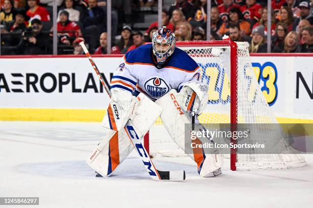 Edmonton Oilers Goalie Stuart Skinner covers his goal during the third period of an NHL game between the Calgary Flames and the Edmonton Oilers on...