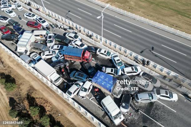This aerial photo taken on December 28, 2022 shows a multi-vehicle collision on Zhengxin Yellow River Bridge in Zhengzhou, in China's central Henan...