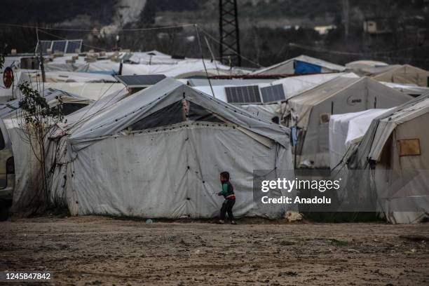 Child is seen in front of makeshift tent at Ataa Refugee Camp, where civilians are displaced by the attacks of Bashar Assad regime as they struggle...