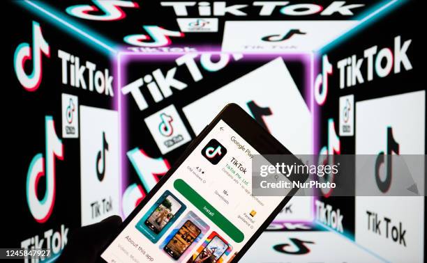 TikTok Logo icon displayed on mobile with TikTok logo seen in the background in this photo illustration, on December 28 in Brussels, Belgium