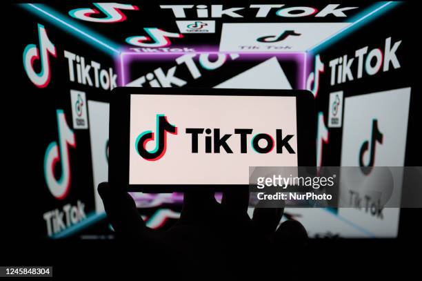 TikTok Logo icon displayed on mobile with TikTok logo seen in the background in this photo illustration, on December 28 in Brussels, Belgium