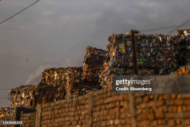Bales of raw materials stacked inside a paper and pulp mill in Muzaffarnagar District, Uttar Pradesh, India, on Monday, Nov. 21, 2022. Plastic...