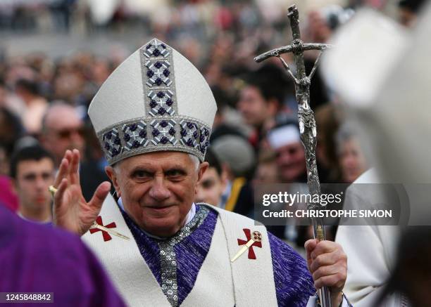 Pope Benedict XVI waves to the faithfull before celebrating a mass to mark the second anniversary of the death of John Paul II in Saint Peter's...