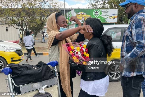 Passengers arriving from Tigray are greeted by relatives at the Bole International Airport in Addis Ababa on December 28, 2022. - Ethiopia's national...